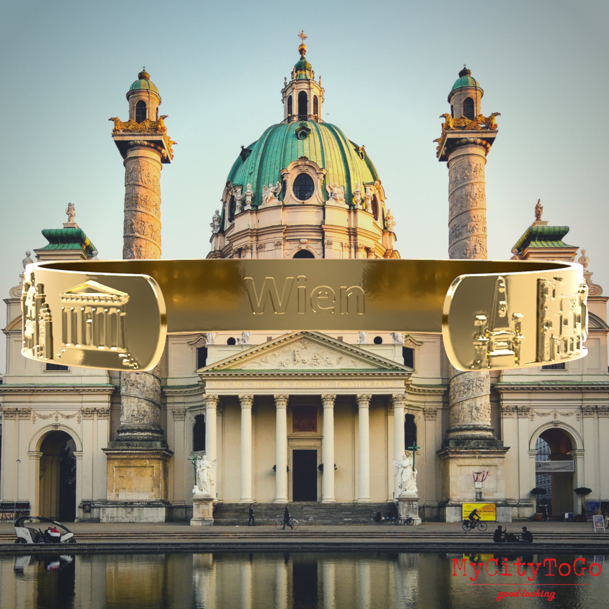 Goldfarbener Armreif mit Reliefs bekannter Motive der Stadt Wien