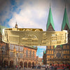 A golden bracelet from MyCityToGo with famous motifs and coordinates of the city of Bremen