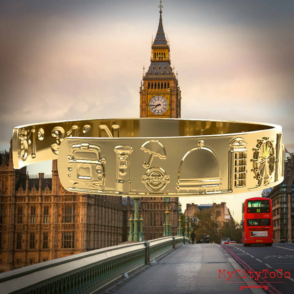 Goldfarbener Armreif mit Reliefs bekannter Motive der Stadt London