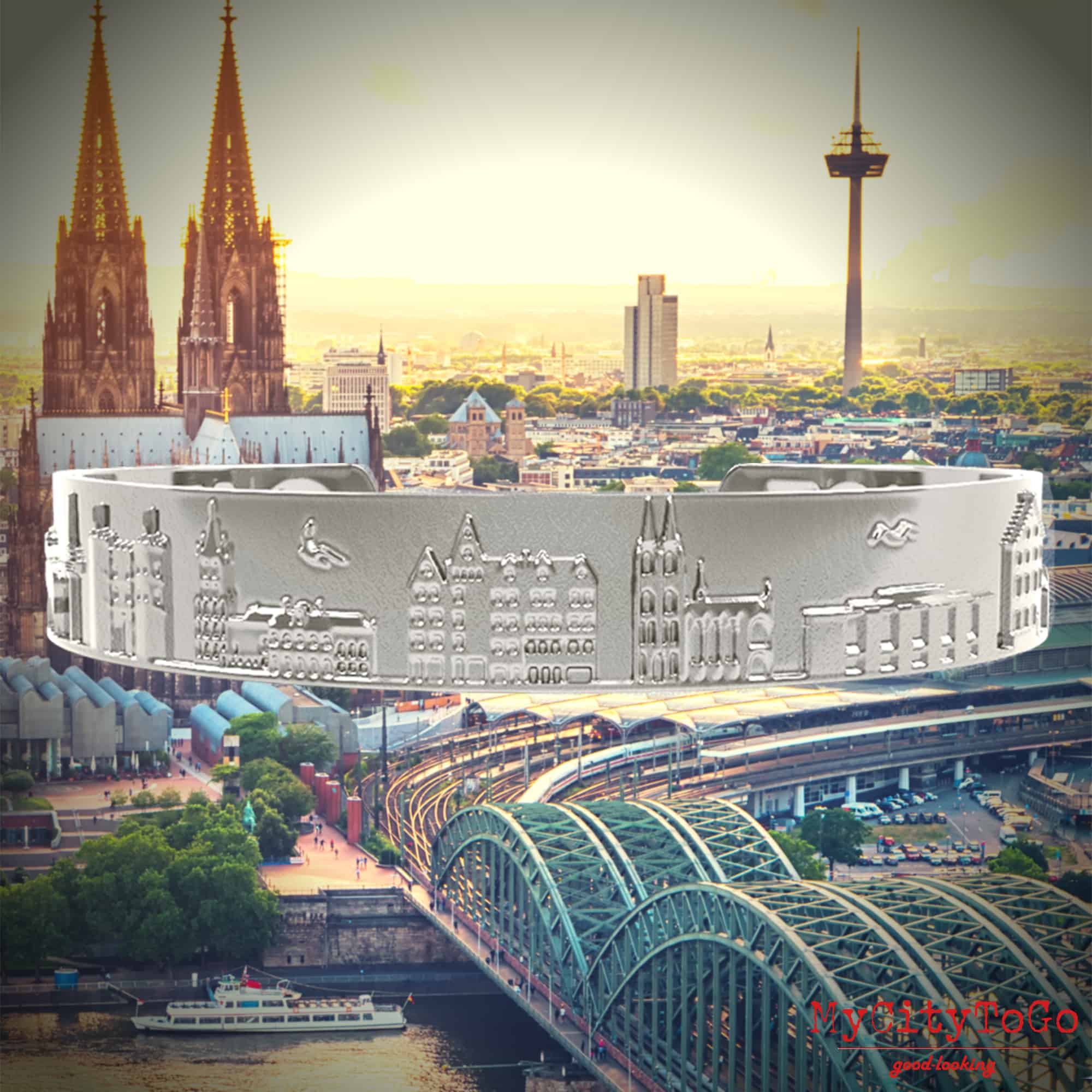 Armreif mit Reliefs bekannter Motive der Stadt Köln in Silber