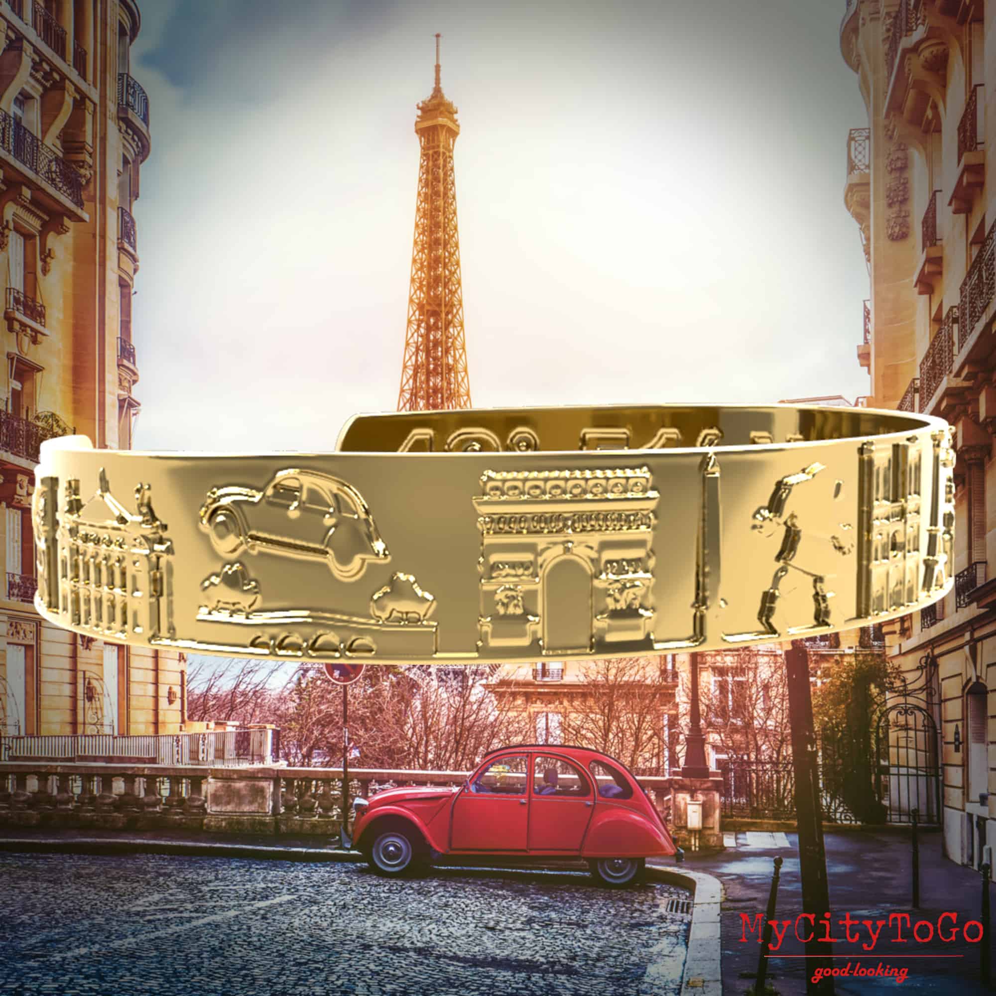 Goldfarbener Armreif mit Reliefs bekannter Motive der Stadt Paris