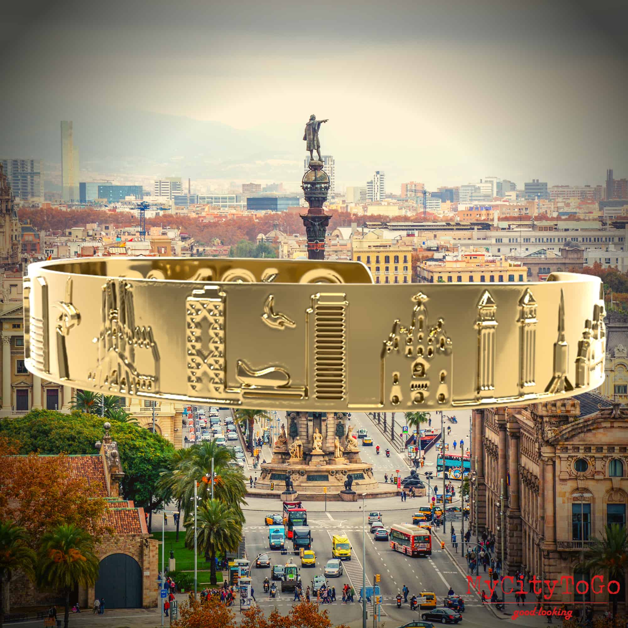 pulsera dorada con motivos y coordenadas de la ciudad de Barcelona