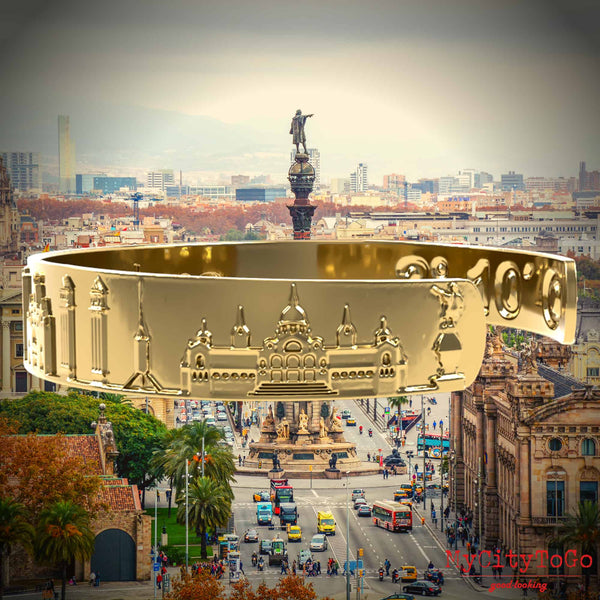 A golden bracelet with famous motifs and coordinates from the city of Barcelona
