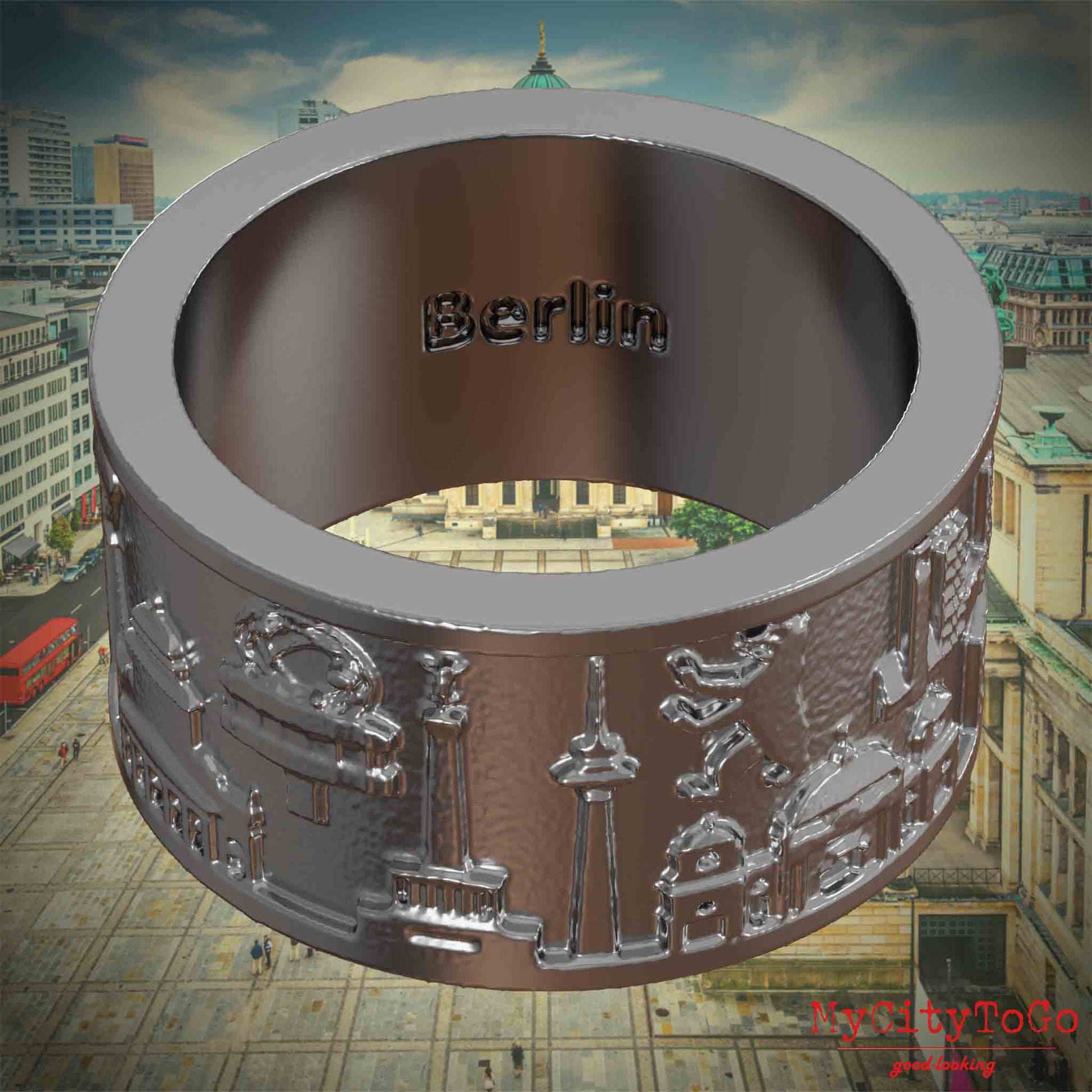 Innenseite eines Rings aus Edelstahl mit Reliefs bekannter Sehenswürdigkeiten der Stadt Berlin und einer Gravur des Stadtnamens 