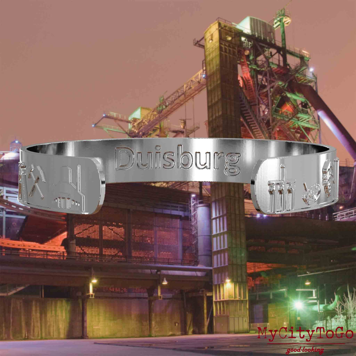 Interior of a silver bangle with reliefs of well-known landmarks in the city of Duisburg and an engraving of the city’s name. The background features a view of the city of Duisburg.