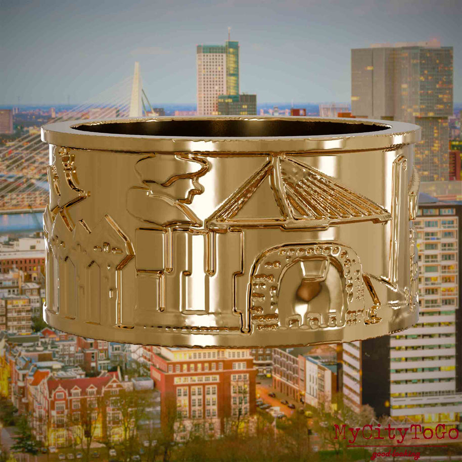 Vergoldeter Ring mit Reliefs bekannter Sehenswürdigkeiten der Stadt Rotterdam. Den Hintergrund bildet eine Ansicht der Stadt Rotterdam.