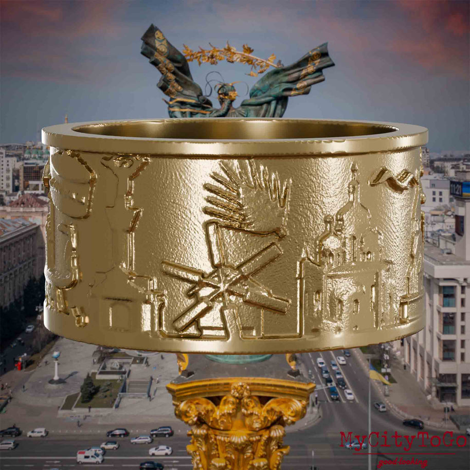 ringve aus vergoldetem Edelstahl mit Reliefs bekannter Sehenswürdigkeiten der Stadt Kiew. Den Hintergrund bildet eine Ansicht der Stadt Kiew.