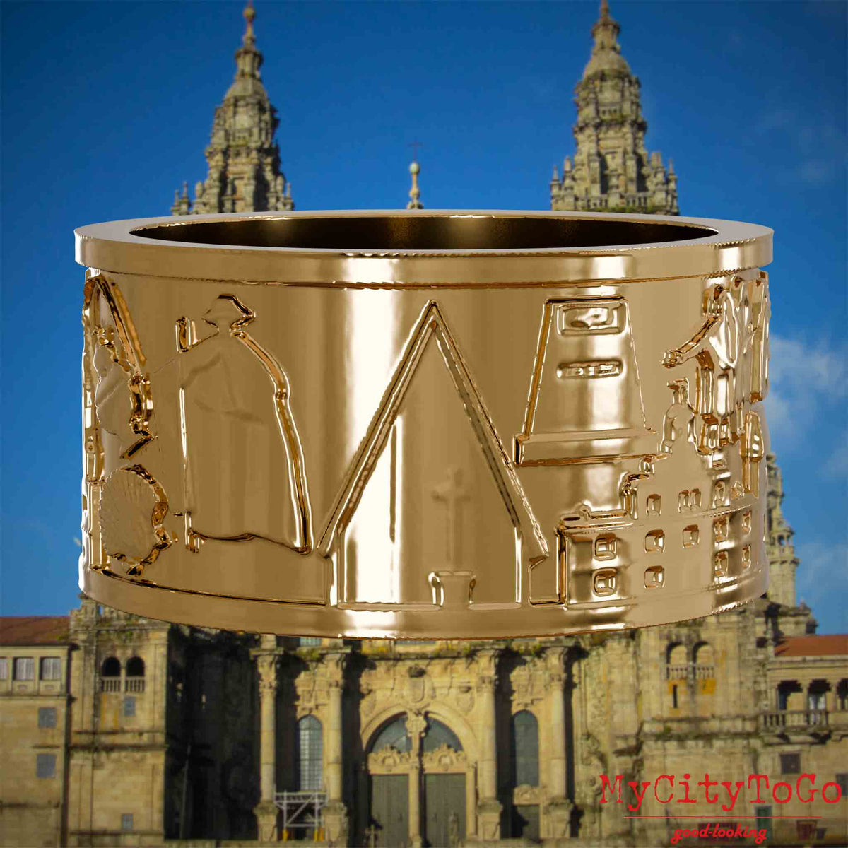 Vergoldeter Ring mit Reliefs bekannter Sehenswürdigkeiten und Wahrzeichen auf dem Jakobsweg. Den Hintergrund bildet die Kathedrale von Santiago de Compostela.