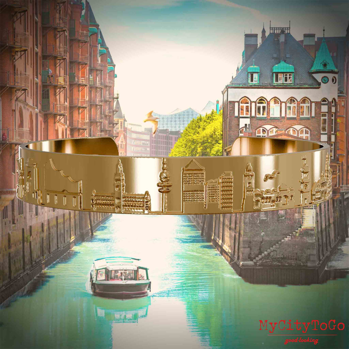 Gold-plated Bangle with reliefs of well-known landmarks of the city of Hamburg. The background features a view of the city of Hamburg.