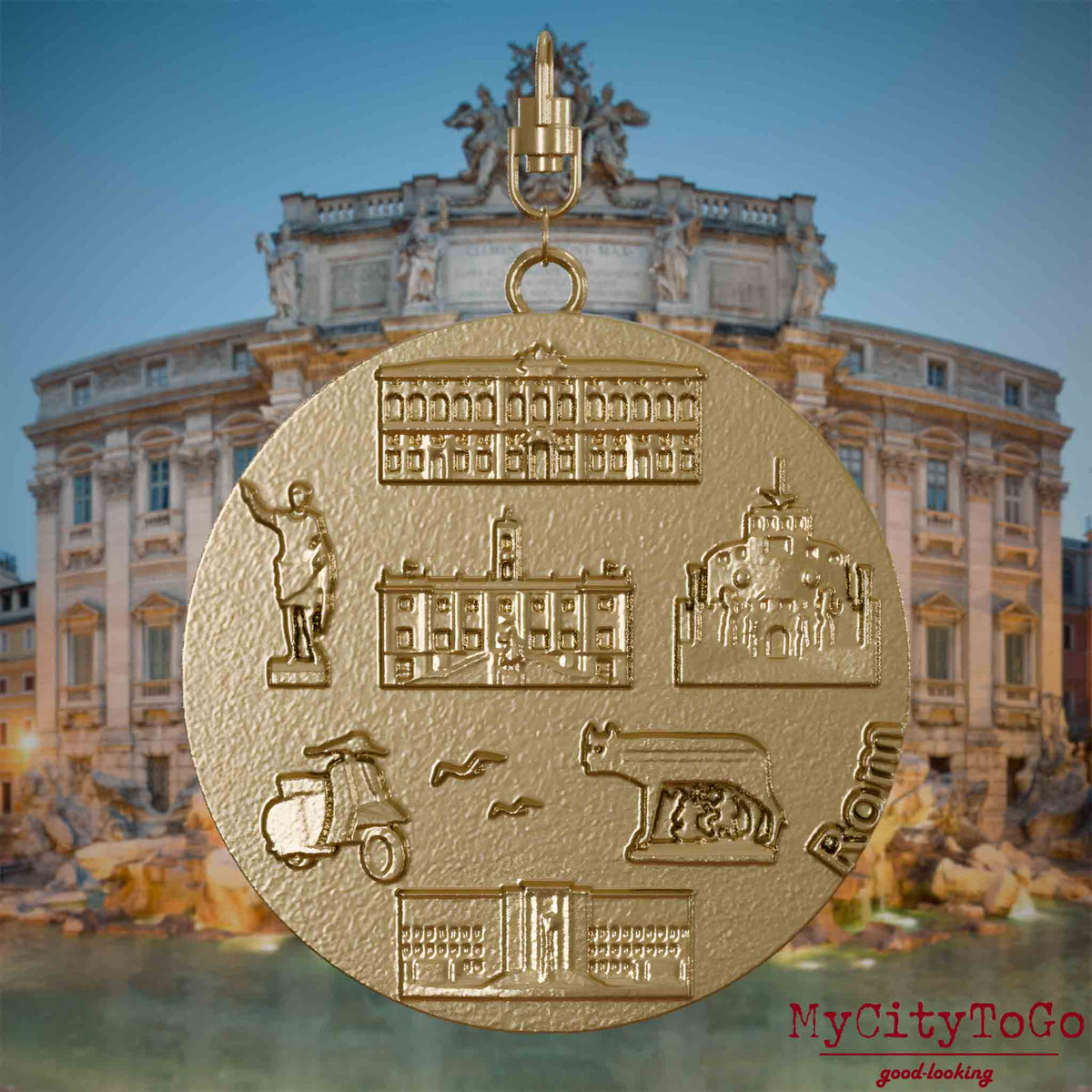 Halskette mit Drehwirbel und Vorderseite eines Schmuckanhängers aus vergoldetem Edelstahl, auf dem Reliefs bekannter Sehenswürdigkeiten der Stadt Rom abgebildet sind. Den Hintergrund bildet eine Ansicht der Stadt Rom.
