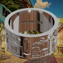 Versilberter Ring mit Reliefs bekannter Sehenswürdigkeiten der Stadt Wuppertal und einer Gravur des Stadtnamens auf der Innenseite. Den Hintergrund bildet eine Ansicht  der Stadt Wuppertal.