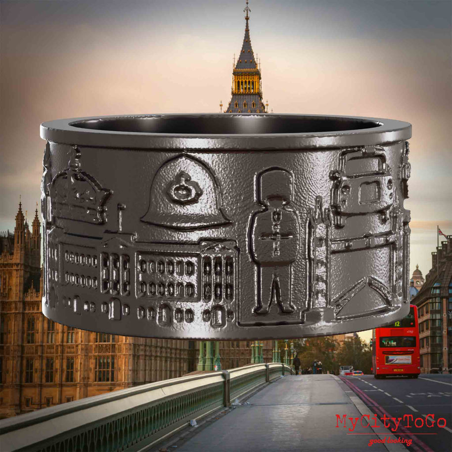 Ring aus Titan mit Reliefs bekannter Sehenswürdigkeiten der Stadt London. Den Hintergrund bildet eine Ansicht der Stadt London.