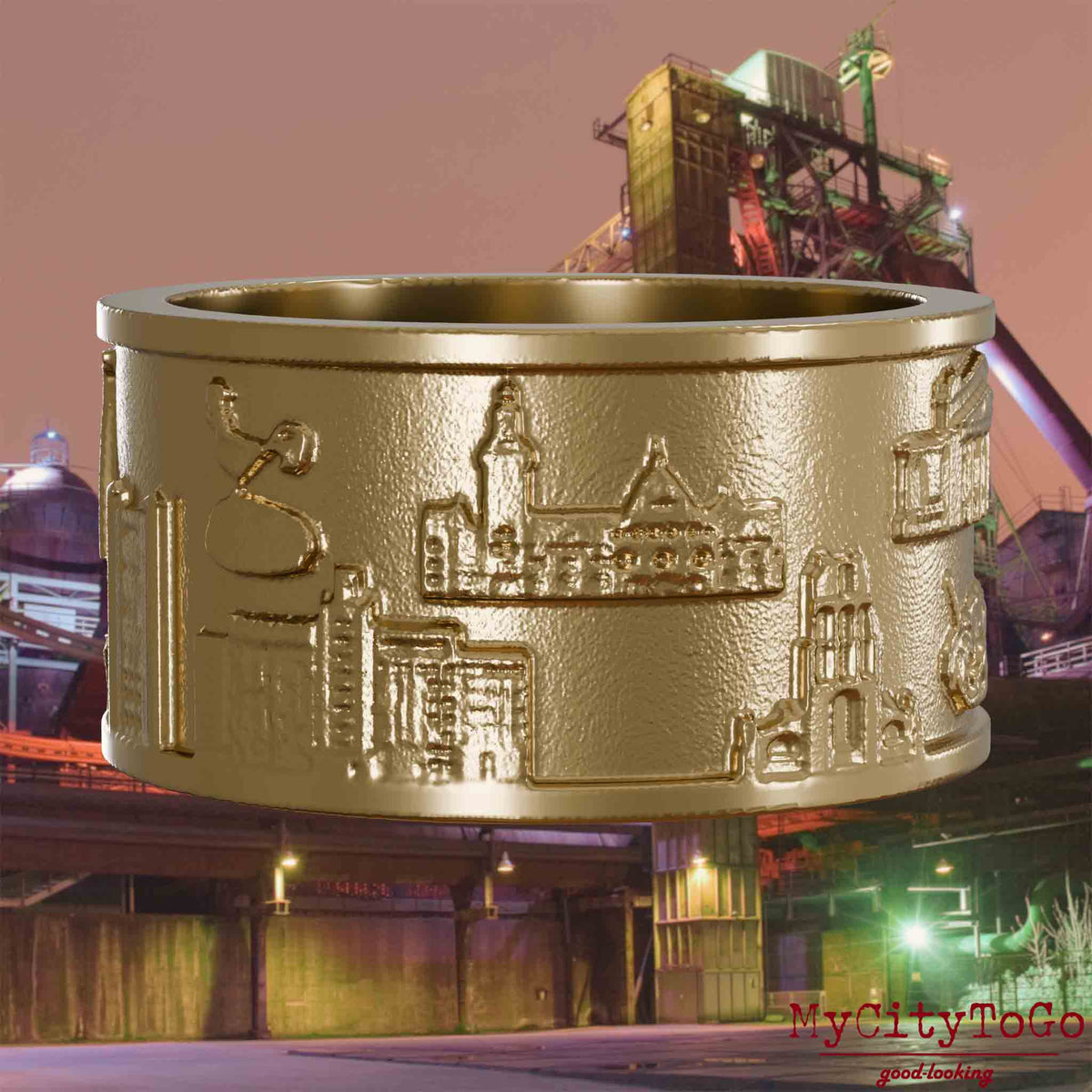 Ring aus vergoldetem Edelstahl mit Reliefs bekannter Sehenswürdigkeiten der Stadt Duisburg. Den Hintergrund bildet eine Ansicht der Stadt Duisburg.