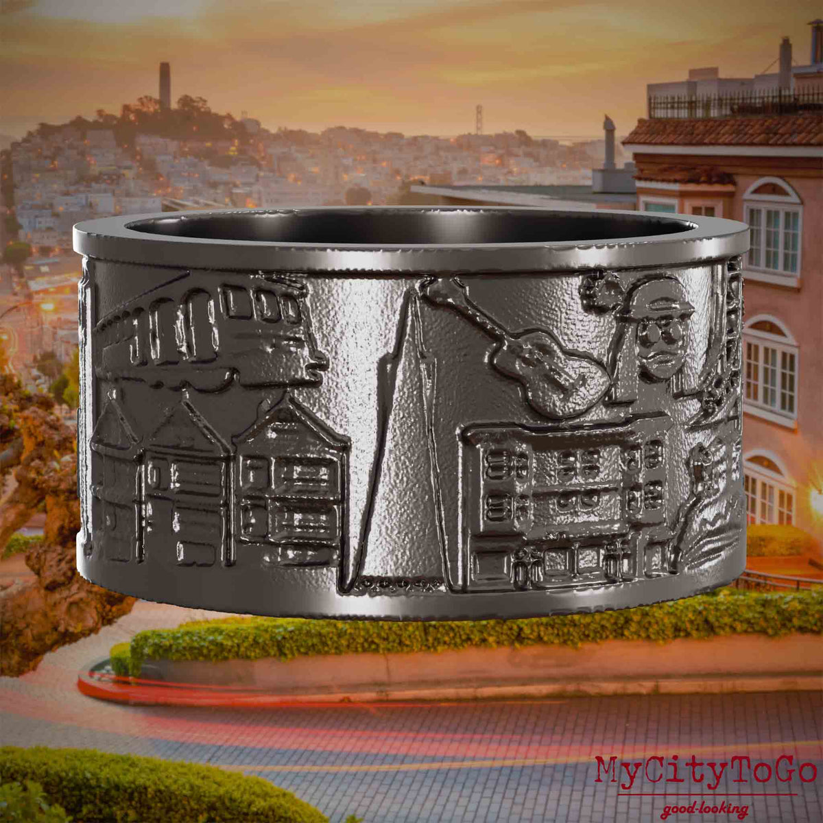 Ring aus Titan mit Reliefs bekannter Sehenswürdigkeiten der Stadt San Francisco. Den Hintergrund bildet eine Ansicht der Stadt San Francisco.