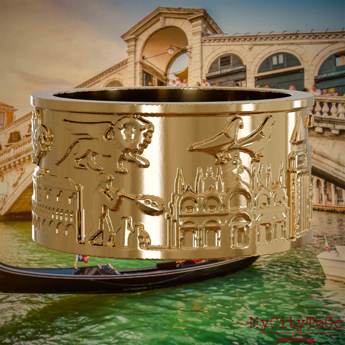 Vergoldeter Ring mit Reliefs bekannter Sehenswürdigkeiten der Stadt Venedig. Den Hintergrund bildet eine Ansicht der Stadt Venedig.