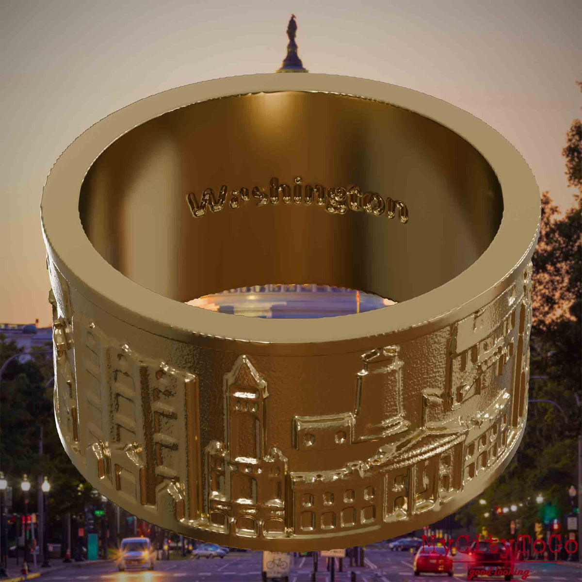 Ring aus vergoldetem Edelstahl mit Reliefs bekannter Sehenswürdigkeiten der Stadt Washington und einer Gravur des Stadtnamens auf der Innenseite. Den Hintergrund bildet eine Ansicht der Stadt Washington.