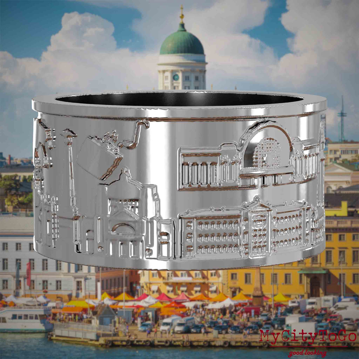 Silberner Ring mit Reliefs bekannter Sehenswürdigkeiten der Stadt Helsinki. Den Hintergrund bildet eine Ansicht der Stadt Helsinki.
