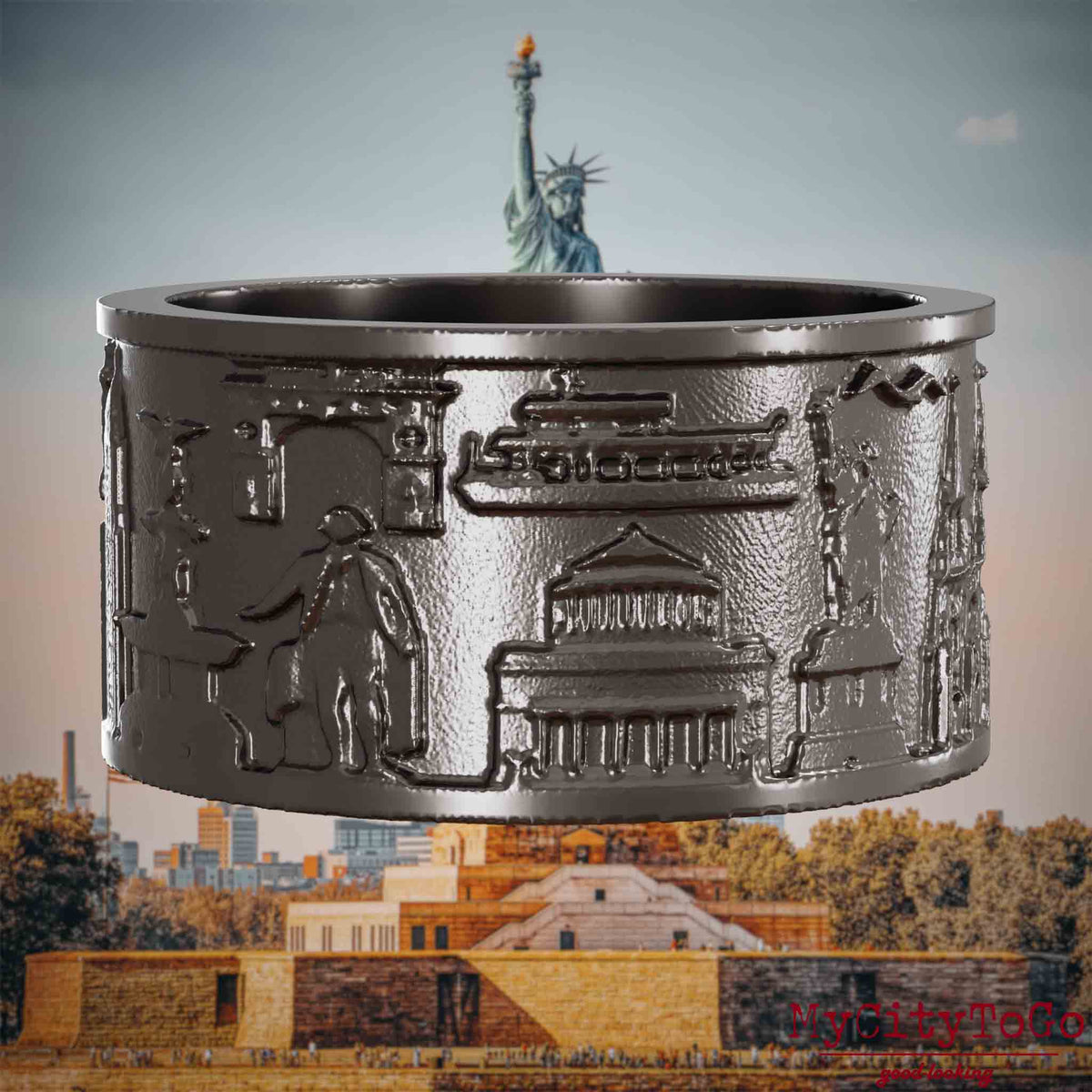 Ring aus Titan mit Reliefs bekannter Sehenswürdigkeiten der Stadt New York. Den Hintergrund bildet eine Ansicht der Stadt New York.