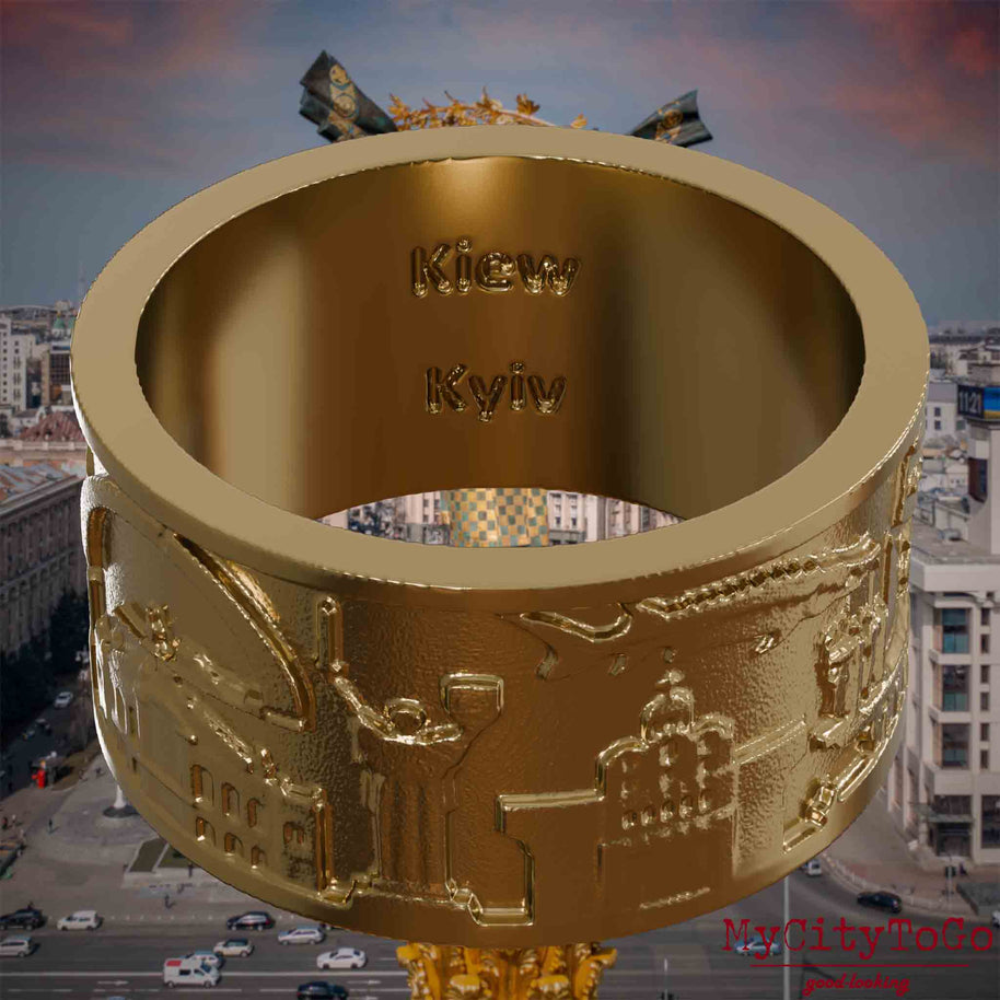 Ring aus vergoldetem Edelstahl mit Reliefs bekannter Sehenswürdigkeiten der Stadt Kiew und einer Gravur des Stadtnamens auf der Innenseite. Den Hintergrund bildet eine Ansicht der Stadt Kiew.
